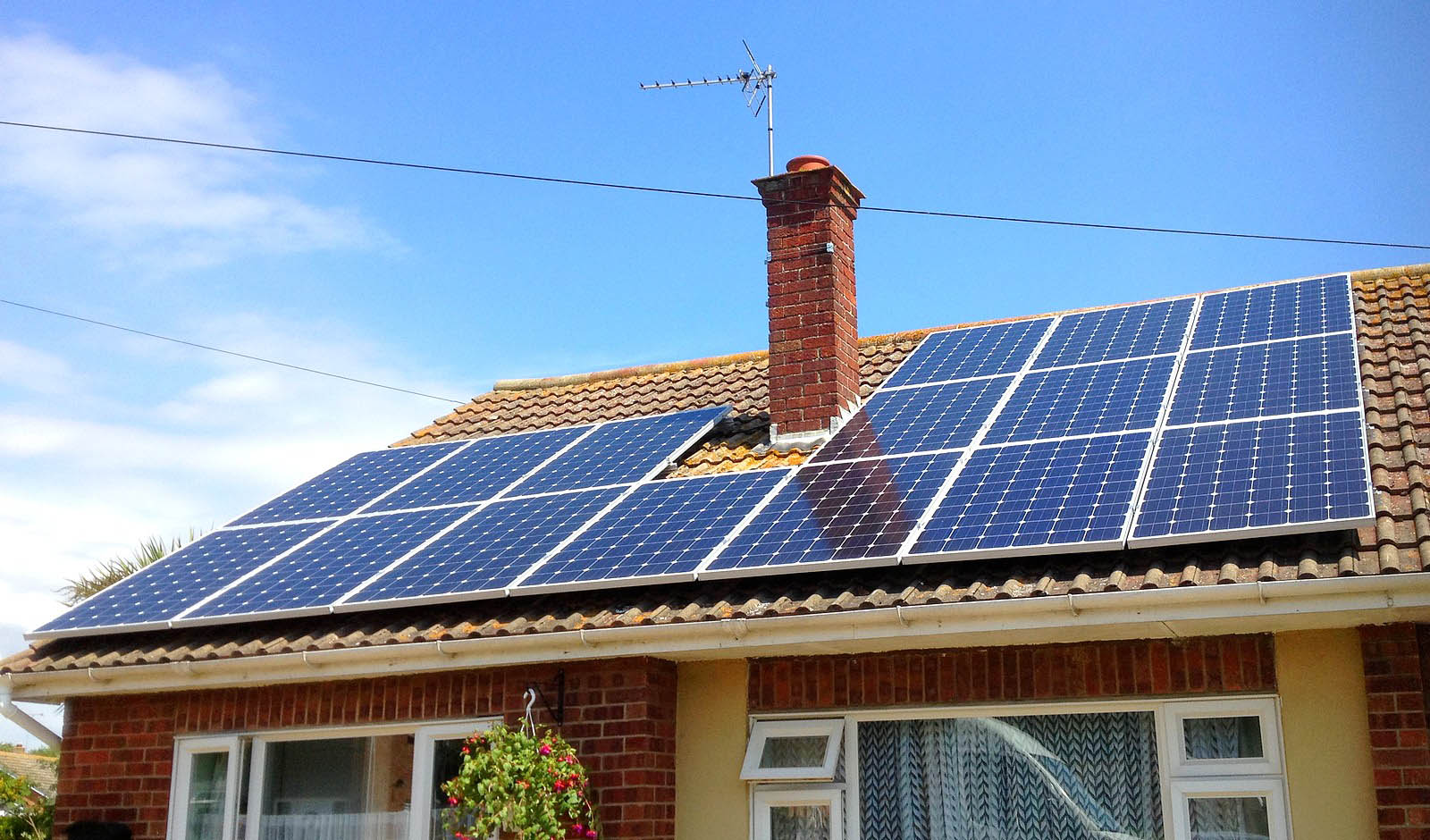 Large set of solar panels installed by Green Solar World over a detached house near Cambridge