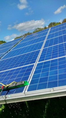 Solar panels near Cambridge cleaning in progress