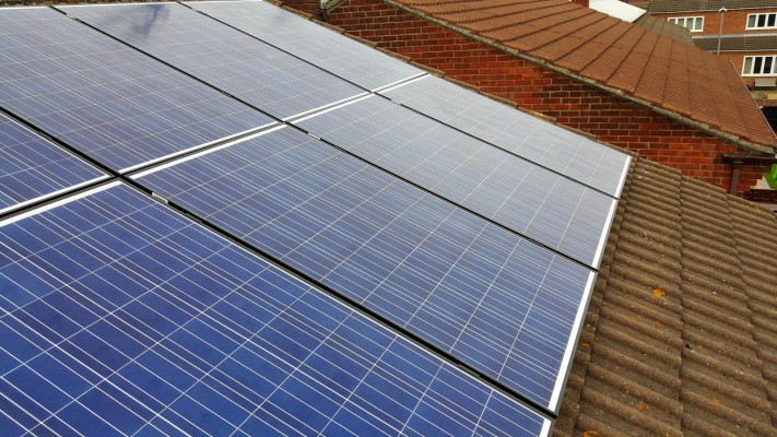Brand new solar panels installed on an open gable roof in Cambridge