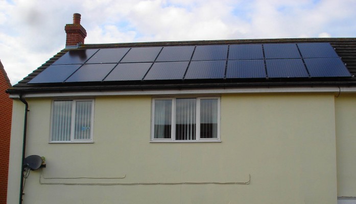Sixteen solar panels generating large amount of energy for a family living in a semi-detached house in Cambridge