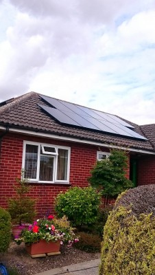 Bungalow house near Cambridge with a set of ten solar panels generating electricity