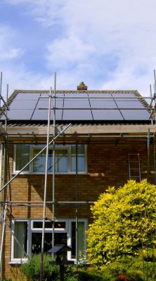 Work in progress solar panels installation over a house near Cambridge